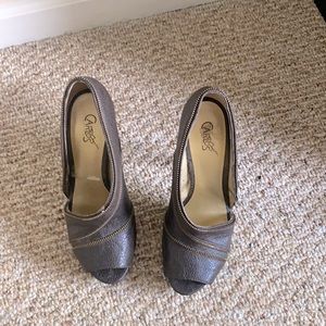 Leather brown open side zipper heels.